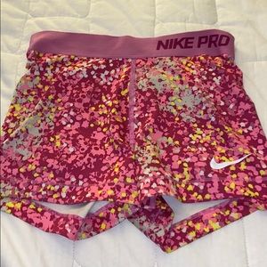 pink multicolor paint splat pattern nike pros